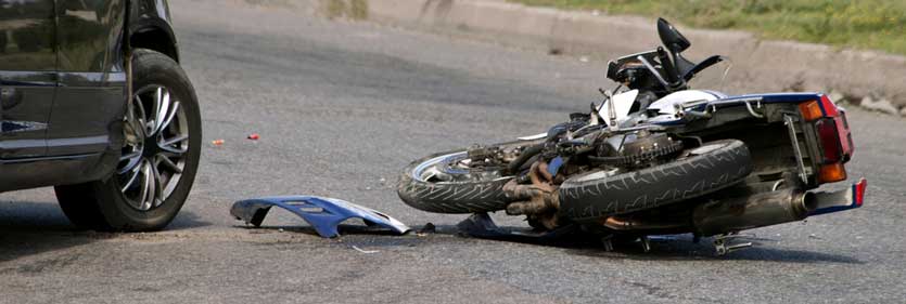 A motorcycle struck by a car in an accident. 