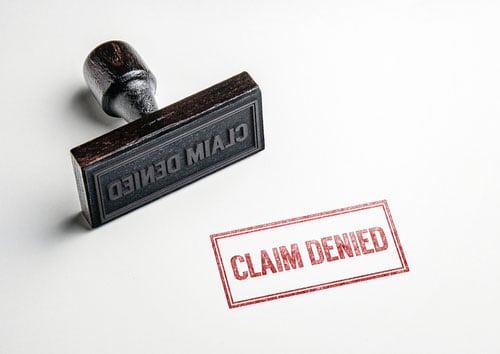 Stamp with words claim denied.