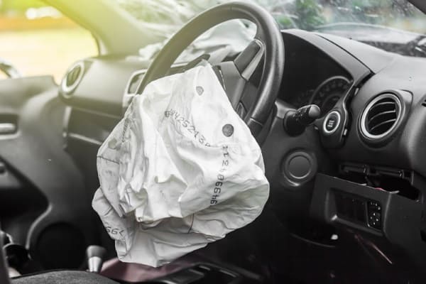 Airbag after car accident bad weather crash concept